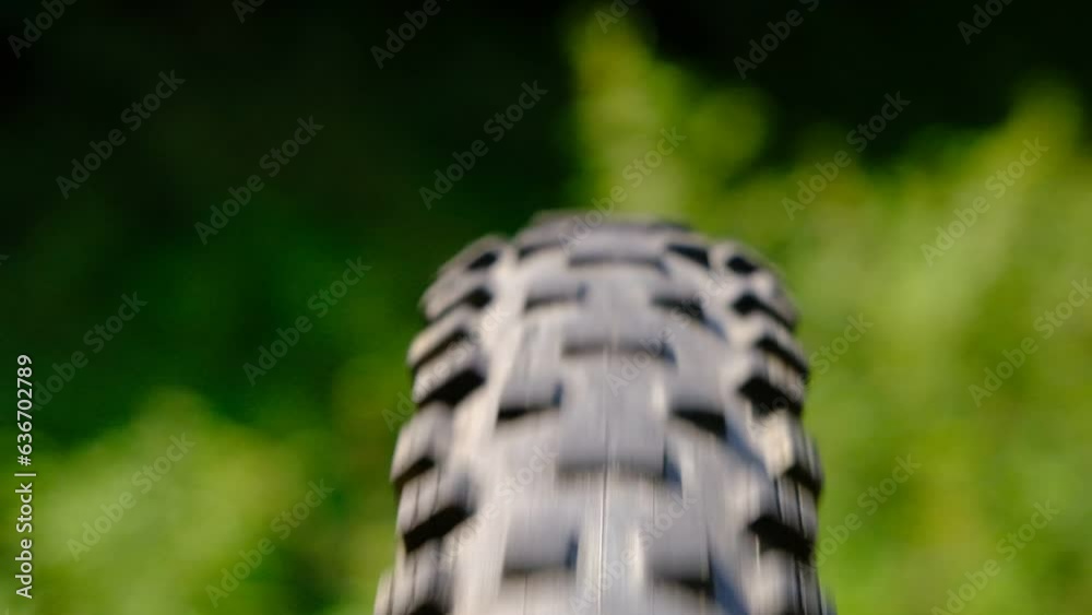 mountain bike tire rotates on background in nature mountain bike tire rotates on background in nature