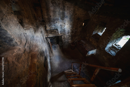 A staircase between floors inside. the foot of the mountains of the watchtowe. Interior Tower of Love in Svaneti in the mountains part of Georgia