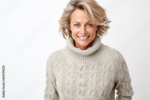 Lifestyle portrait of a Russian woman in her 40s in a white background wearing a cozy sweater