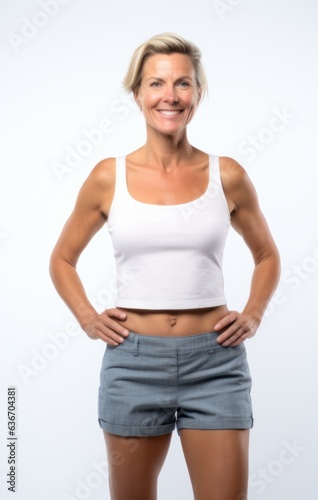 Group portrait of a Russian woman in her 40s in a white background wearing knee-length shorts