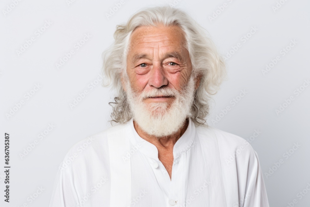 Portrait of senior man looking at camera isolated on white background.