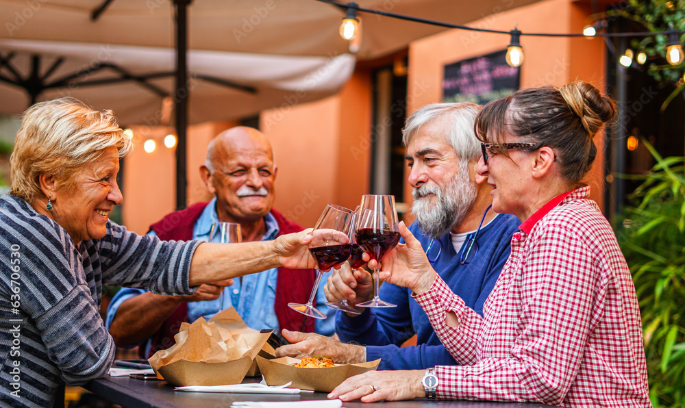 Elderly couples eat and drink together - Old friends have a reunion in a restaurant Elderly couples eat and drink together - Old friends have a reunion in a restaurant