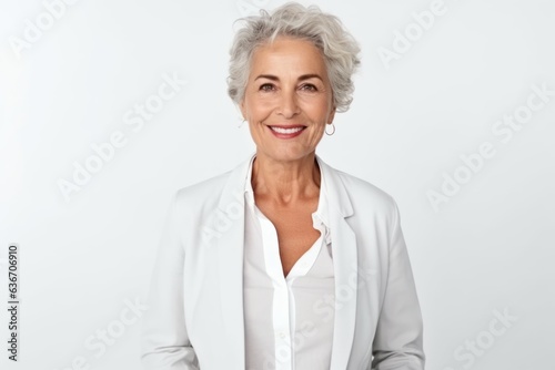 portrait of smiling senior businesswoman looking at camera isolated on white