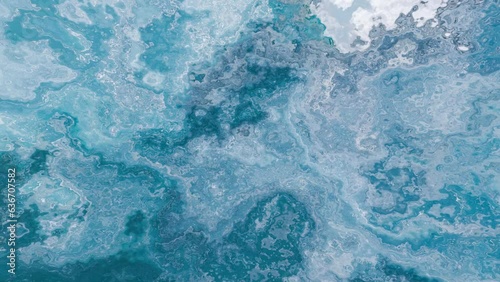 Ocean Abstract Liquid Movement Background 4K Loop features liquid movement similar to looking at caustics in a pool or water in a loop.