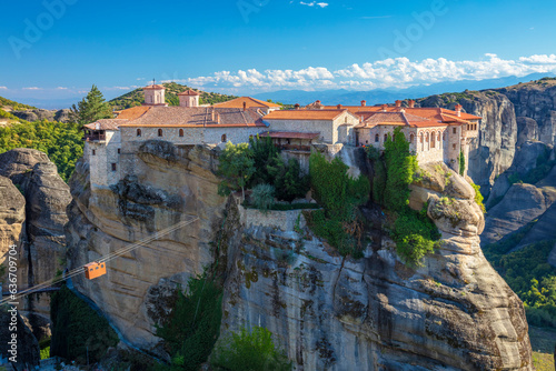 Meteora monasteries, Greece. Panoramic view on the Holy Monastery of Varlaam placed on the edge of high rock. The Meteora area is on UNESCO World Heritage. Greece