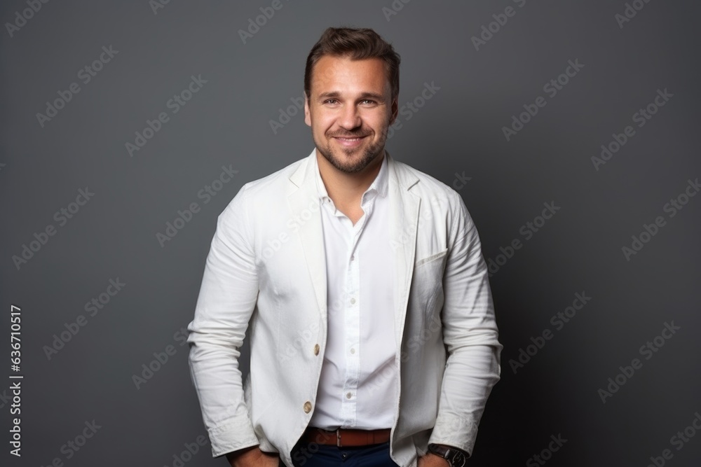 Portrait of handsome young man in white shirt on grey background. Portrait of handsome young man in white shirt on grey background.