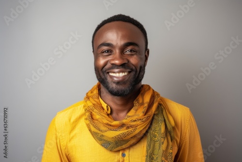 Portrait of a happy young african american man wearing yellow scarf