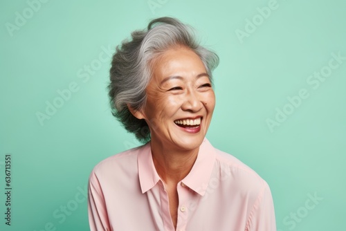 Portrait of happy senior asian woman smiling and looking at camera