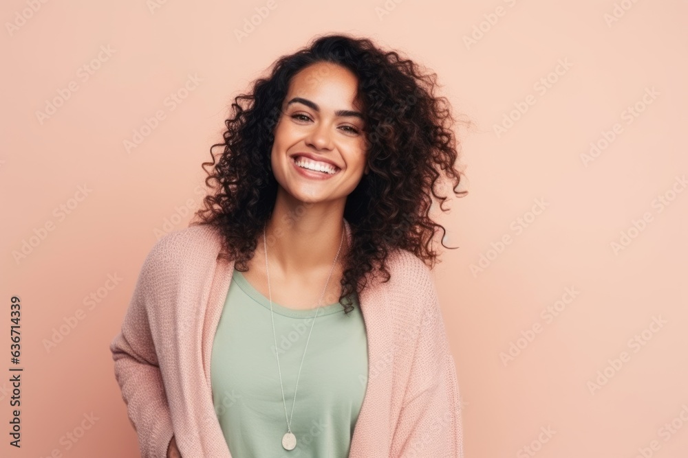 Portrait of a beautiful young woman with curly hair on a pink background Portrait of a beautiful young woman with curly hair on a pink background