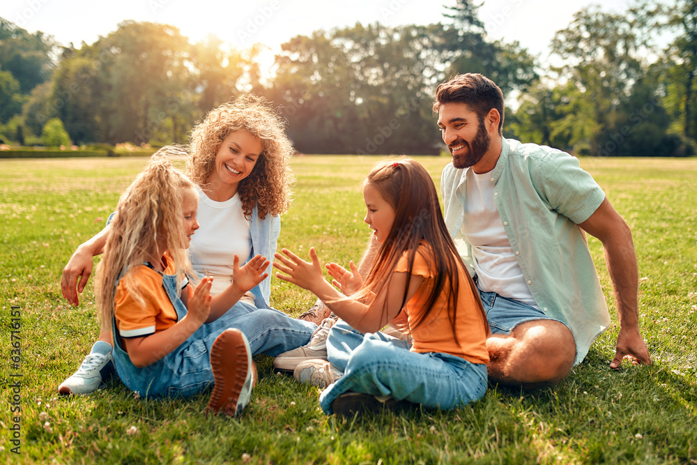 Happy family relaxing in the park Happy family relaxing in the park