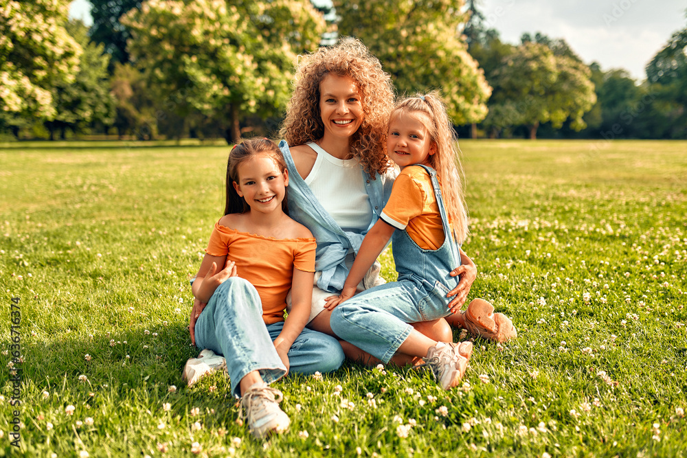 Happy family relaxing in the park Happy family relaxing in the park