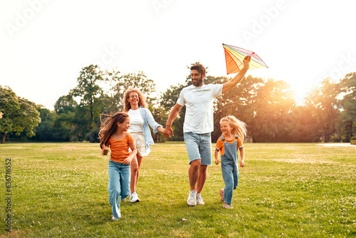 Happy family relaxing in the park