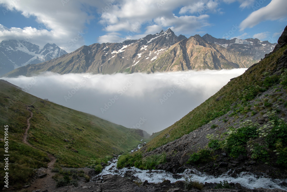 Beautiful mountain landscape with fog and river