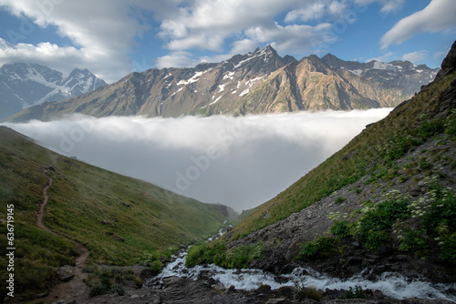 Beautiful mountain landscape with fog and river