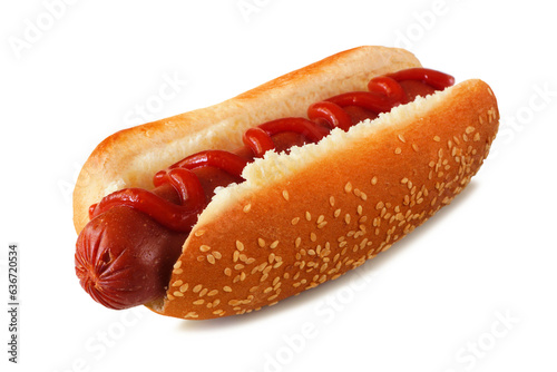 Hot dog with ketchup in a sesame seed bun. Side view isolated on a white background.