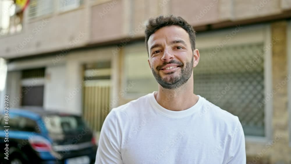Young hispanic man smiling confident standing at street Young hispanic man smiling confident standing at street