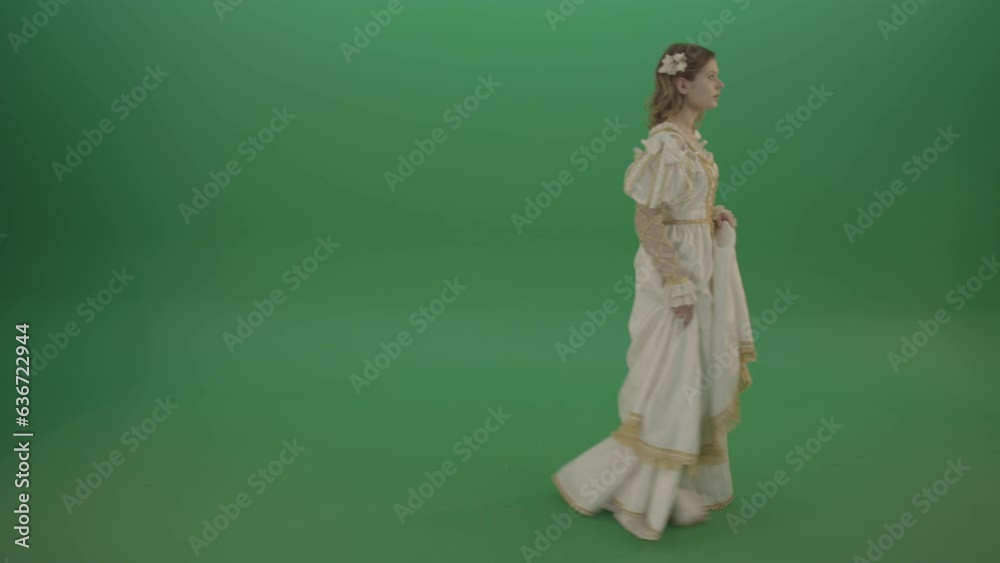 Mysterious princess makes a white dress, goes aside isolated on green background Mysterious princess makes a white dress, goes aside isolated on green background