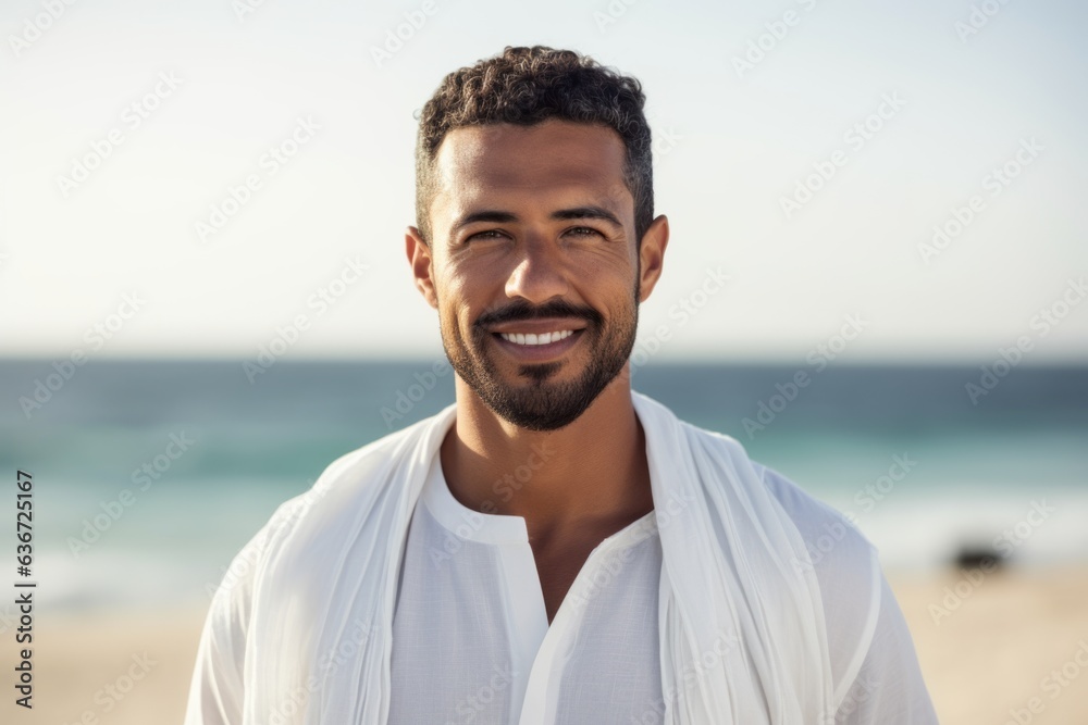 Portrait of smiling man in bathrobe standing at beach on a sunny day Portrait of smiling man in bathrobe standing at beach on a sunny day
