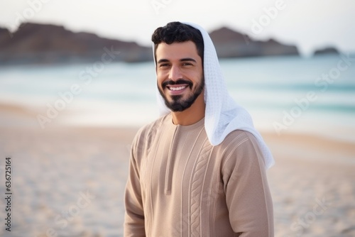 Portrait of a smiling arabic man standing on the beach
