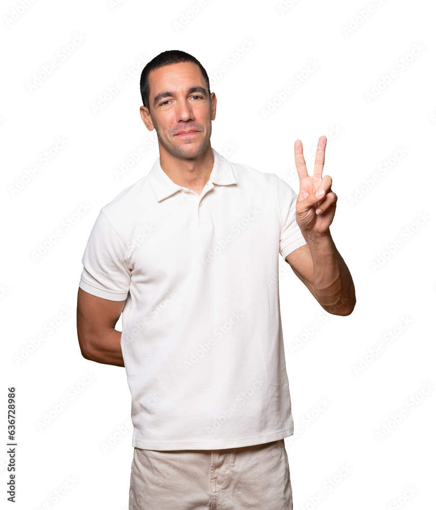 Young man making a number two gesture Young man making a number two gesture