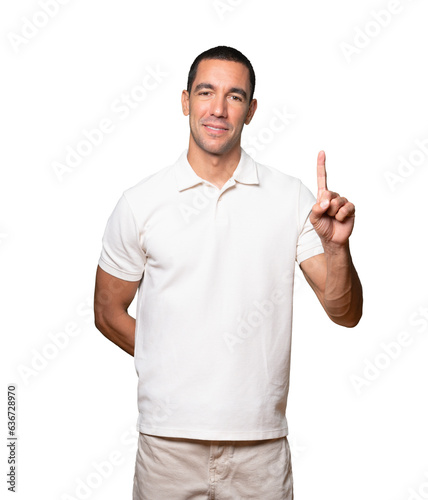 Young man making a number one gesture