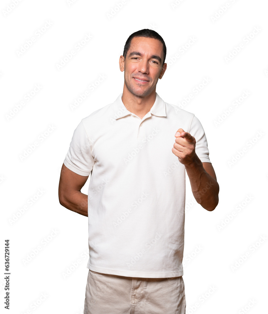 Happy young man pointing at you with his finger Happy young man pointing at you with his finger