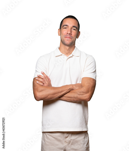 Satisfied young man with crossed arms gesture