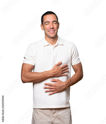 Happy young man thinking of food