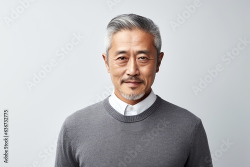 Obraz na płótnie Portrait of an old asian man with grey hair and grey sweater w salonie
