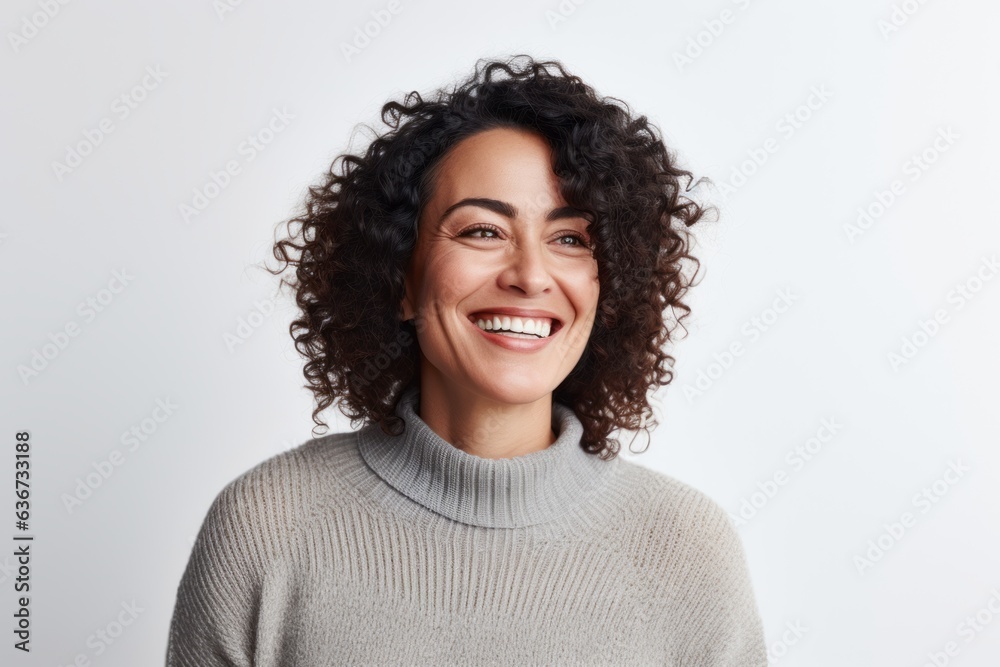 Portrait of a happy young woman with curly hair smiling and looking at camera Portrait of a happy young woman with curly hair smiling and looking at camera