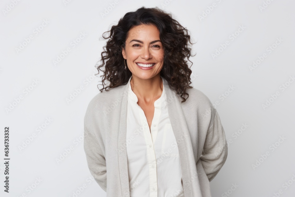 Portrait of a happy businesswoman smiling at camera over white background Portrait of a happy businesswoman smiling at camera over white background