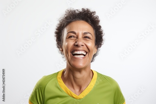 Portrait of a happy african american woman laughing against white background © Hanne Bauer