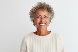 Portrait of a happy senior woman smiling at camera isolated over white background