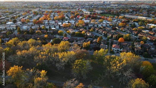 Aerial view of tightly located houses in Montreal suburban area. Real estate development. Real estate, top down view of townhouses. Drone footage of Canadian Neighborhood in autumn. 