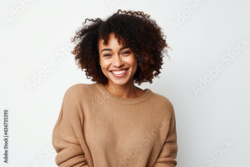 Portrait of a beautiful young african american woman smiling against white background