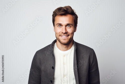 Portrait of a smiling man looking at camera isolated on a white background