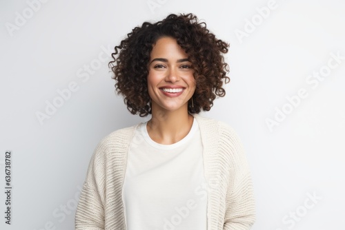 Portrait of beautiful young african american woman with curly hair smiling at camera