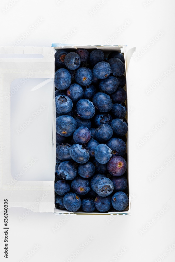 the box of blueberries is left open to show the inside the box of blueberries is left open to show the inside