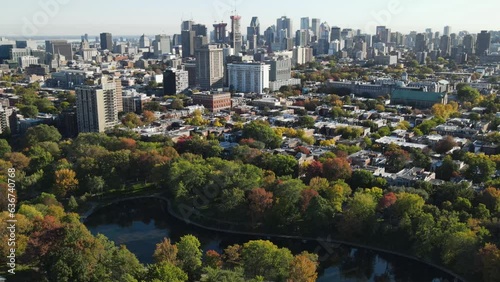 Aerial view of road in old district in Montreal. Drone footage of city, Montreal, Canada at autumn. Downtown cityscapes. View of Mont Royal mountain park.  Drone footage on sunset.