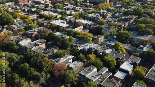 Aerial view of tightly located houses in Montreal suburban area. Real estate development. Real estate, top down view of townhouses. Drone footage of Canadian Neighborhood in autumn. 