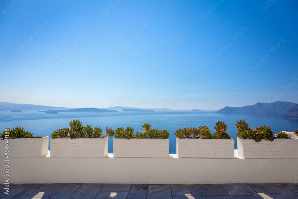 Conceptual background - Santorini. Greece, Santorini island, Oia - white architecture, flowers and blue sea and sky. Abstract background, empty space. Greek Islands, Santorini