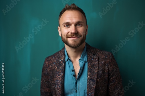 Portrait of a Russian man in his 30s in an abstract background wearing a chic cardigan