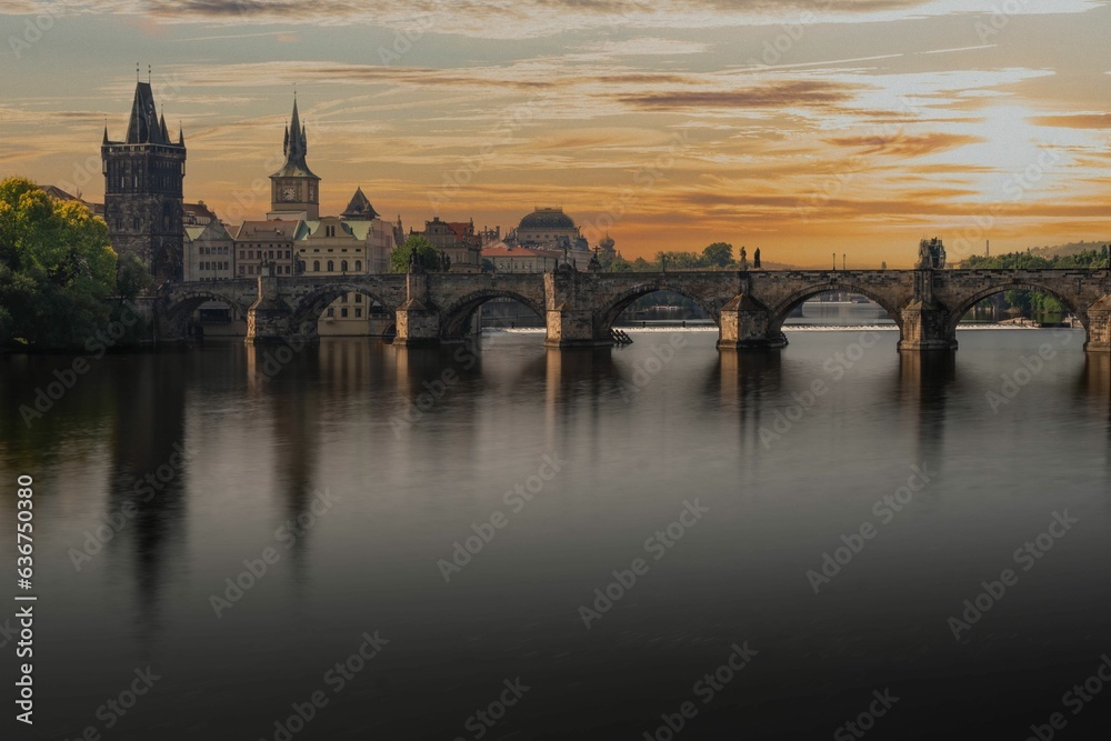 Scenic view of the Charles bridge in Prague, Czechia at sunset