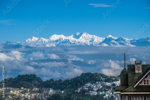 Aerial view of town Darjeeling surrounded by buildings in background of mountain Kanchenjunga photo