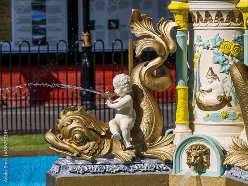 Ornamented fountain at Aberdare Park in South Wales with an angel statue photo