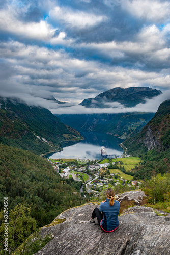 Tourist in Norway - Woman admires the view from Flydalsjuvet Viewpoint photo