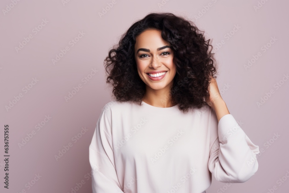 Portrait of a Saudi Arabian woman in her 30s in a pastel or soft colors background wearing a snuggly pajama set Portrait of a Saudi Arabian woman in her 30s in a pastel or soft colors background wearing a snuggly pajama set