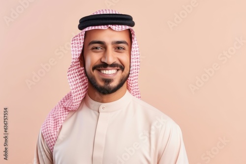 Medium shot portrait of a Saudi Arabian man in his 30s in a pastel or soft colors background wearing a chic cardigan