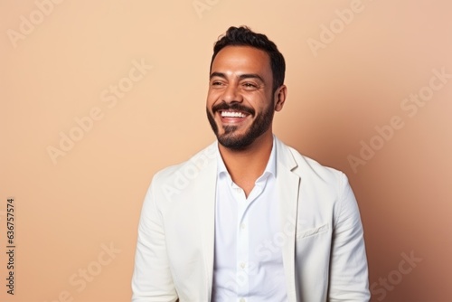 Medium shot portrait of a Saudi Arabian man in his 30s in a pastel or soft colors background wearing a chic cardigan