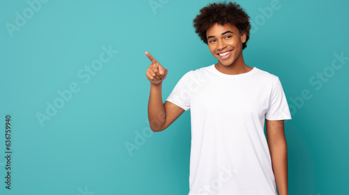 Middle aged man wearing cwhite T-shirt pointing with hand and finger to the side looking at the camera. photo